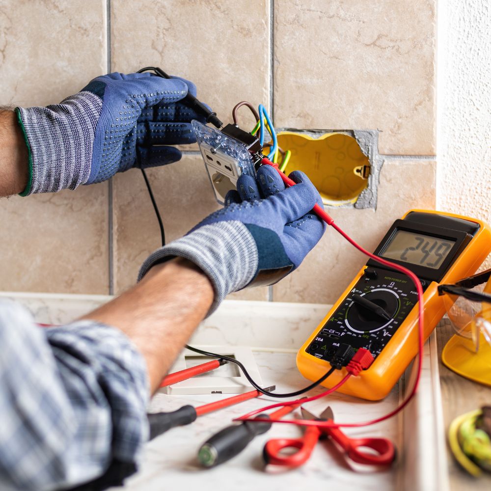 man rewiring a socket